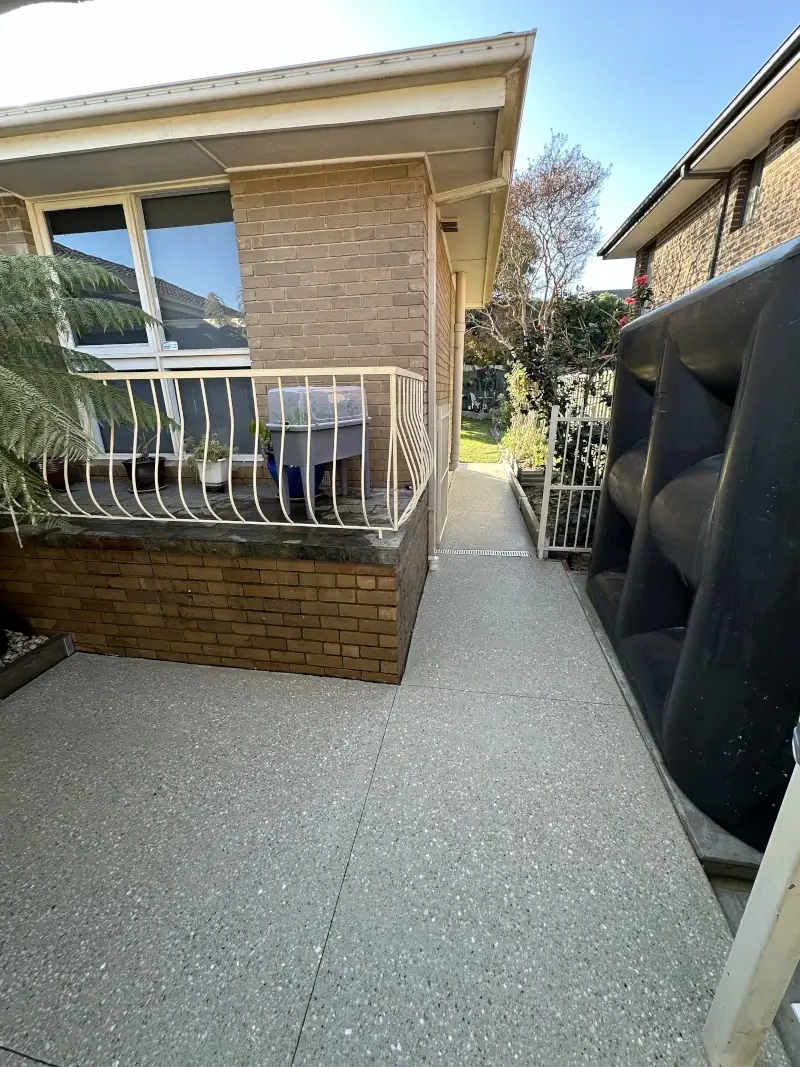 Exposed aggregate concrete walkway and driveway